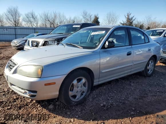 2004 Hyundai Elantra GLS with VIN KMHDN46D74U788645, listed as a Copart auction lot 57315104 with 296,563 mi miles and Salvage title. Bid and sale history available at DreamBid. Image 1.