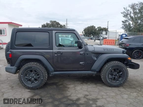 ✅ 2022 Jeep Wrangler Willys Sport • VIN: 1C4GJXAN7NW252931 • Lot: 40972143. Listed on IAAI with 12,823 mi. Free auction sales archive from the USA and detailed vehicle history report at DreamBid. Image 13.