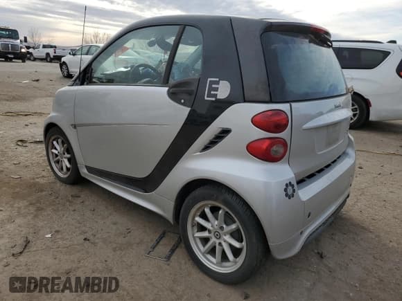 ✅ 2015 Smart fortwo Passion • VIN: WMEEJ9AA1FK831357 • Lot: 87001564. Listed on Copart with Not provided. Free auction sales archive from the USA and detailed vehicle history report at DreamBid. Image 2.