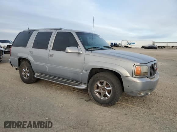 ✅ 2000 GMC Denali • VIN: 1GKEK63R9YR225073 • Lot: 86819964. Listed on Copart with 207,827 mi. Free auction sales archive from the USA and detailed vehicle history report at DreamBid. Image 4.