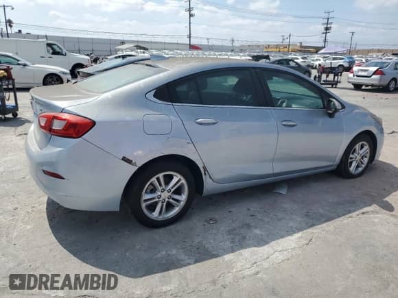 ✅ 2018 Chevrolet Cruze LT • VIN: 1G1BE5SM2J7114834 • Lot: 80557205. Listed on Copart with 131,256 mi. Free auction sales archive from the USA and detailed vehicle history report at DreamBid. Image 3.