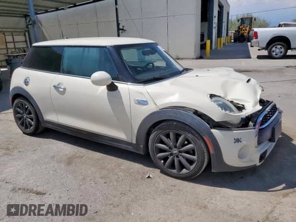 2015 MINI Hardtop S with VIN WMWXP7C56F2A58203, listed as a Copart auction lot 62602855 with 101,679 mi miles and Salvage title. Bid and sale history available at DreamBid. Image 4.