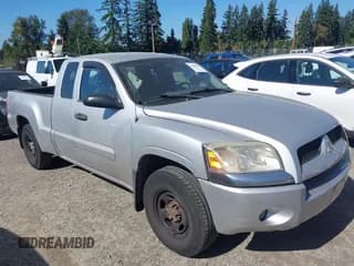 ✅ 2007 Mitsubishi Raider LS • VIN: 1Z7HC22K67S265500 • Lot: 43283446. Listed on IAAI with 114,084 mi. Free auction sales archive from the USA and detailed vehicle history report at DreamBid. Image 1.