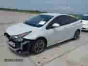 2021 Toyota Prius L Eco with VIN JTDKAMFU9M3136865, listed as a IAAI auction lot 42476212 with 16,961 mi miles and . Bid and sale history available at DreamBid. Image 2.