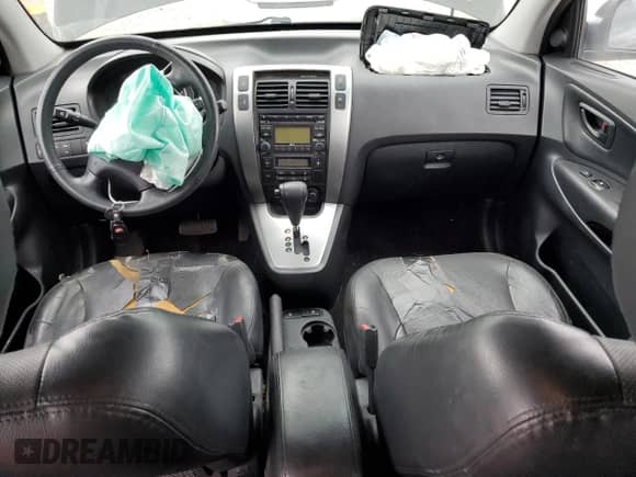 2009 Hyundai Tucson SE z VIN KM8JN72D49U975875, wystawiony jako Copart lot #76923954 z przebiegiem 167 155 mil mil oraz Szkoda całkowita • Salvage title. Historia ofert i sprzedaży dostępna na DreamBid. Obrazek 8.