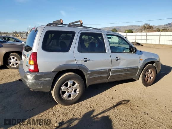 ✅ 2001 Mazda Tribute LX • VIN: 4F2CU08111KM20113 • Lot: 87681195. Listed on Copart with 144,400 mi. Free auction sales archive from the USA and detailed vehicle history report at DreamBid. Image 3.