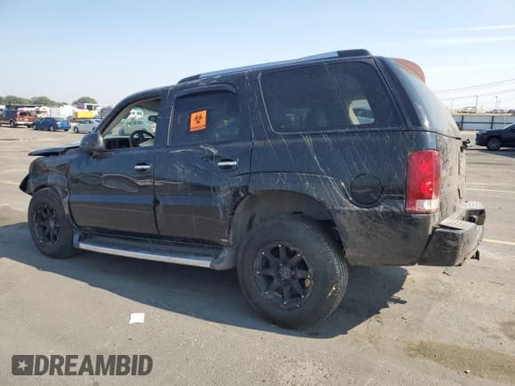 ✅ 2003 Cadillac Escalade • VIN: 1GYEK63N53R154630 • Лот: 70531985. Опубликован ранее на Copart с пробегом Не указан. Бесплатный доступ к архиву аукционных продаж из США и подробный отчёт об истории автомобиля на DreamBid. Изображение 2.