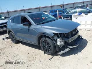 ✅ 2022 Mazda CX-5 S Carbon Edition • VIN: JM3KFBCM7N1543338 • Lot: 41994700. Listed on IAAI with 67,855 mi. Free auction sales archive from the USA and detailed vehicle history report at DreamBid. Image 1.