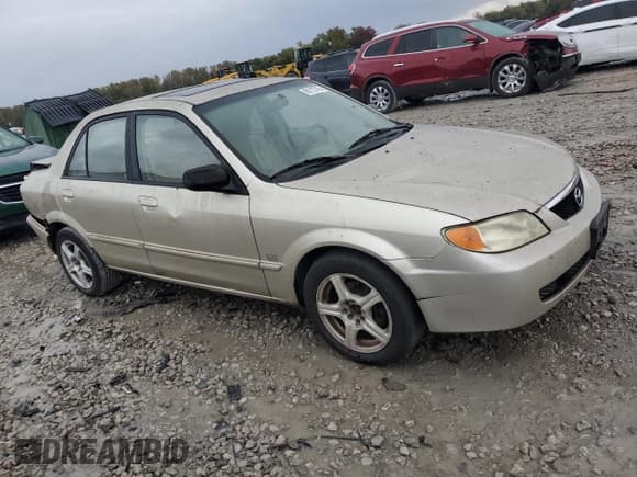 ✅ 2001 Mazda Protege LX • VIN: JM1BJ225410404415 • Лот: 90113745. Опубликован ранее на Copart с пробегом 272 439 миль. Бесплатный доступ к архиву аукционных продаж из США и подробный отчёт об истории автомобиля на DreamBid. Изображение 4.