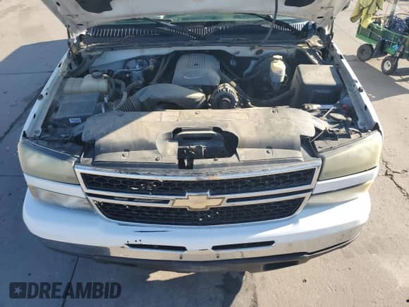 2006 Chevrolet Silverado 1500 LS z VIN 1GCEK19V16Z207120, wystawiony jako Copart lot #69255924 z przebiegiem 215 962 mil mil oraz Szkoda całkowita • Salvage title. Historia ofert i sprzedaży dostępna na DreamBid. Obrazek 11.