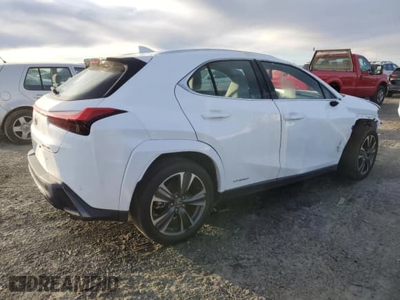 ✅ 2022 Lexus UX 250h F Sport • VIN: JTHE9JBHXN2057983 • Лот: 46143515. Опубликован ранее на Copart с пробегом 27 367 миль. Бесплатный доступ к архиву аукционных продаж из США и подробный отчёт об истории автомобиля на DreamBid. Изображение 3.