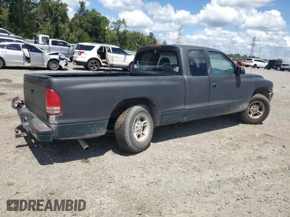 1998 Dodge Dakota SLT z VIN 1B7GL22X2WS567075, wystawiony jako Copart lot #69710974 z przebiegiem 151 920 mil mil oraz Szkoda całkowita • Salvage title. Historia ofert i sprzedaży dostępna na DreamBid. Obrazek 3.