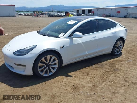 ✅ 2018 Tesla Model 3 Long Range Battery • VIN: 5YJ3E1EAXJF053717 • Lot: 42615984. Listed on IAAI with 79,735 mi. Free auction sales archive from the USA and detailed vehicle history report at DreamBid. Image 2.