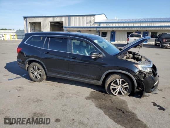 ✅ 2016 Honda Pilot EX-L • VIN: 5FNYF6H71GB078451 • Lot: 80149475. Listed on Copart with 146,812 mi. Free auction sales archive from the USA and detailed vehicle history report at DreamBid. Image 4.