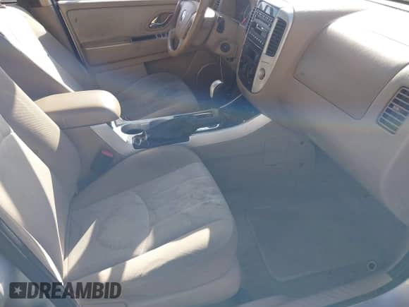 2006 Mercury Mariner Luxury z VIN 4M2YU56196DJ05801, wystawiony jako IAAI lot #42528336 z przebiegiem 162 851 mil mil oraz . Historia ofert i sprzedaży dostępna na DreamBid. Obrazek 5.