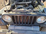 ✅ 2000 Jeep Wrangler Sport • VIN: 1J4FA49S9YP738234 • Lot: 91114555. Listed on Copart with 245,066 mi. Free auction sales archive from the USA and detailed vehicle history report at DreamBid. Image 11.