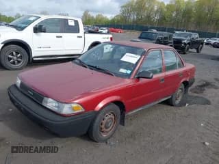 ✅ 1990 Toyota Corolla • VIN: JT2AE91AXL3318396 • Lot: 42186060. Listed on IAAI with 128,403 mi. Free auction sales archive from the USA and detailed vehicle history report at DreamBid. Image 2.