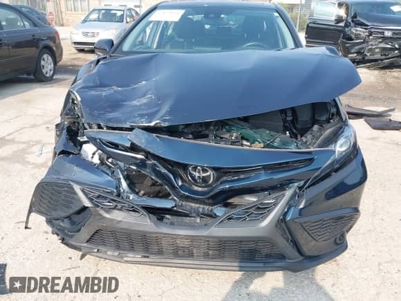 2021 Toyota Camry SE with VIN 4T1T11BKXMU042040, listed as a IAAI auction lot 42879951 with 35,130 mi miles and . Bid and sale history available at DreamBid. Image 12.