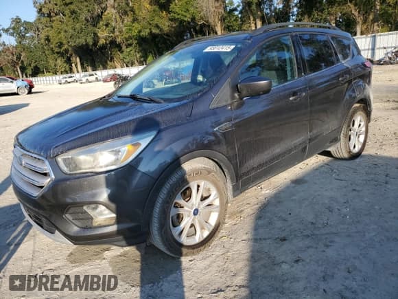 ✅ 2018 Ford Escape SE • VIN: 1FMCU0GD7JUC27721 • Lot: 93012415. Listed on Copart with 144,625 mi. Free auction sales archive from the USA and detailed vehicle history report at DreamBid. Image 1.
