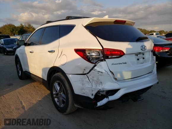 ✅ 2018 Hyundai Santa Fe 2.4L • VIN: 5NMZU3LB0JH053048 • Лот: 69140052. Опубликован ранее на Copart с пробегом 83 445 миль. Бесплатный доступ к архиву аукционных продаж из США и подробный отчёт об истории автомобиля на DreamBid. Изображение 2.
