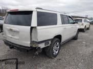 ✅ 2015 Chevrolet Suburban LTZ • VIN: 1GNSKKKC7FR290156 • Lot: 43777007. Listed on IAAI with 145,354 mi. Free auction sales archive from the USA and detailed vehicle history report at DreamBid. Image 4.