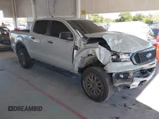 ✅ 2021 Ford Ranger XL • VIN: 1FTER4EH1MLD92959 • Lot: 43679230. Listed on IAAI with 77,330 mi. Free auction sales archive from the USA and detailed vehicle history report at DreamBid. Image 1.