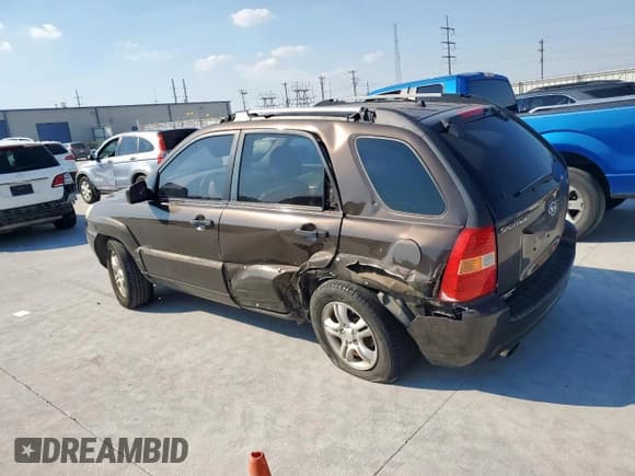 ✅ 2006 Kia Sportage LX • VIN: KNDJF723167163274 • Лот: 81846425. Опубликован ранее на Copart с пробегом 241 774 миль. Бесплатный доступ к архиву аукционных продаж из США и подробный отчёт об истории автомобиля на DreamBid. Изображение 2.