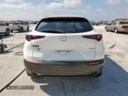 ✅ 2022 Mazda CX-30 S Premium • VIN: 3MVDMBDL6NM458473 • Лот: 66364035. Опубликован ранее на Copart с пробегом 64 305 миль. Бесплатный доступ к архиву аукционных продаж из США и подробный отчёт об истории автомобиля на DreamBid. Изображение 6.