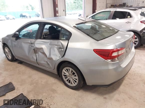 ✅ 2017 Subaru Impreza Premium • VIN: 4S3GKAB64H3602636 • Lot: 43153516. Listed on IAAI with 90,021 mi. Free auction sales archive from the USA and detailed vehicle history report at DreamBid. Image 3.
