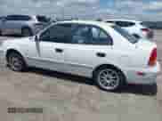 2003 Hyundai Accent GL z VIN KMHCG45C53U468978, wystawiony jako IAAI lot #41999193 z przebiegiem 105 514 mil mil oraz . Historia ofert i sprzedaży dostępna na DreamBid. Obrazek 14.