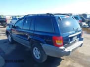✅ 2001 Jeep Grand Cherokee Laredo • VIN: 1J4GX48SX1C705230 • Lot: 43292992. Listed on IAAI with 233,950 mi. Free auction sales archive from the USA and detailed vehicle history report at DreamBid. Image 3.
