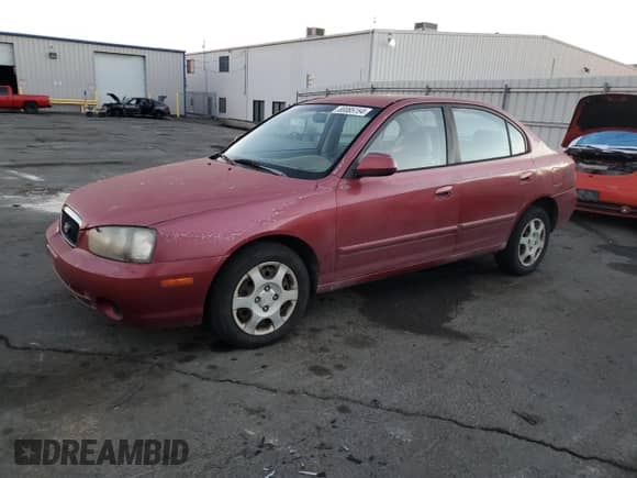 2003 Hyundai Elantra GLS z VIN KMHDN45D53U586516, wystawiony jako Copart lot #80085154 z przebiegiem 199 522 mil mil oraz Szkoda całkowita • Salvage title. Historia ofert i sprzedaży dostępna na DreamBid. Obrazek 1.