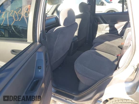 ✅ 1999 Jeep Grand Cherokee Laredo • VIN: 1J4GW58S1XC520727 • Lot: 43730318. Wystawiony na IAAI z przebiegiem 154 356 mil. Bezpłatny archiwum sprzedaży aukcyjnych z USA i szczegółowy raport historii pojazdu na DreamBid. Zdjęcie 8.