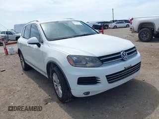 ✅ 2012 Volkswagen Touareg Lux • VIN: WVGEK9BP6CD008434 • Lot: 42871719. Listed on IAAI with 144,745 mi. Free auction sales archive from the USA and detailed vehicle history report at DreamBid. Image 1.