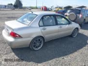 ✅ 2005 Mitsubishi Lancer ES • VIN: JA3AJ26E55U014748 • Lot: 41935566. Listed on IAAI with 255,336 mi. Free auction sales archive from the USA and detailed vehicle history report at DreamBid. Image 4.