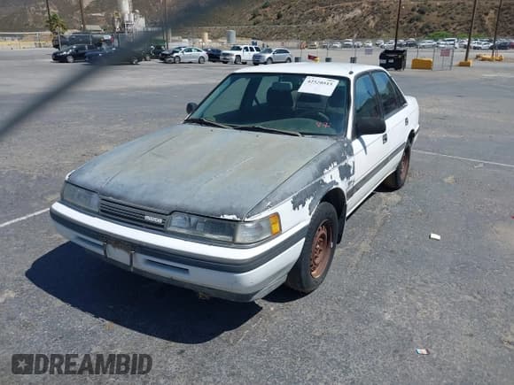 ✅ 1990 Mazda 626 • VIN: 1YVGD22B8L5242825 • Lot: 42520515. Listed on IAAI with 193,191 mi. Free auction sales archive from the USA and detailed vehicle history report at DreamBid. Image 2.