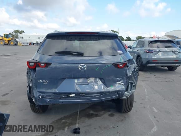 ✅ 2025 Mazda CX-50 S Preferred • VIN: 7MMVABBM1SN392085 • Lot: 43723950. Listed on IAAI with 1,452 mi. Free auction sales archive from the USA and detailed vehicle history report at DreamBid. Image 17.