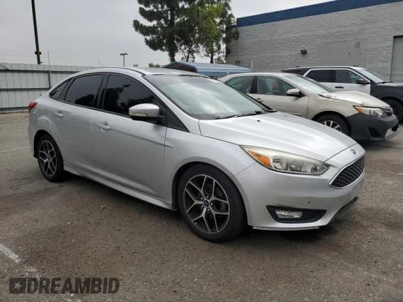 ✅ 2015 Ford Focus SE • VIN: 1FADP3F28FL348729 • Lot: 61936225. Listed on Copart with 107,351 mi. Free auction sales archive from the USA and detailed vehicle history report at DreamBid. Image 4.