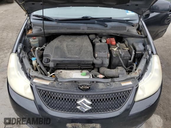 ✅ 2012 Suzuki SX4 LE • VIN: JS2YC5A3XC6304007 • Lot: 80989485. Listed on Copart with 178,892 mi. Free auction sales archive from the USA and detailed vehicle history report at DreamBid. Image 11.