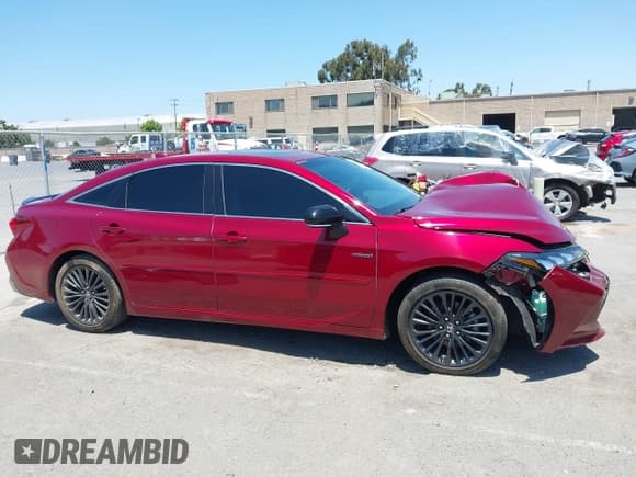 ✅ 2021 Toyota Avalon Hybrid XSE • VIN: 4T1EA1AB0MU009591 • Lot: 42574344. Wystawiony na IAAI z przebiegiem 73 018 mil. Bezpłatny archiwum sprzedaży aukcyjnych z USA i szczegółowy raport historii pojazdu na DreamBid. Zdjęcie 13.