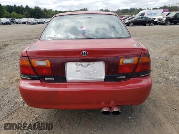 ✅ 1995 Mazda Protege • VIN: JM1BA1413S0173593 • Лот: 68877974. Опубликован ранее на Copart с пробегом 133 411 миль. Бесплатный доступ к архиву аукционных продаж из США и подробный отчёт об истории автомобиля на DreamBid. Изображение 6.
