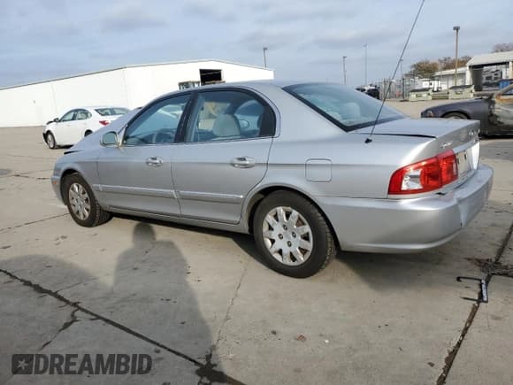 ✅ 2006 Kia Optima LX • VIN: KNAGD126565468244 • Лот: 85373304. Опубликован ранее на Copart с пробегом 118 397 миль. Бесплатный доступ к архиву аукционных продаж из США и подробный отчёт об истории автомобиля на DreamBid. Изображение 2.