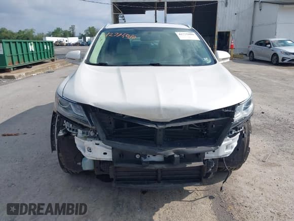 ✅ 2016 Lincoln MKC Select • VIN: 5LMTJ2DHXGUJ18266 • Lot: 42775080. Listed on IAAI with 102,755 mi. Free auction sales archive from the USA and detailed vehicle history report at DreamBid. Image 12.