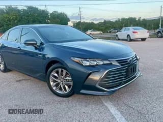 ✅ 2021 Toyota Avalon Hybrid XLE • VIN: 4T1AA1AB6MU002711 • Лот: 66050335. Опубликован ранее на Copart с пробегом 98 890 миль. Бесплатный доступ к архиву аукционных продаж из США и подробный отчёт об истории автомобиля на DreamBid. Изображение 1.