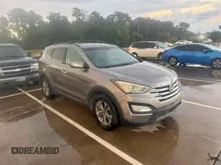 2015 Hyundai Santa Fe z VIN 5XYZU3LB2FG297317, wystawiony jako Copart lot #85947915 z przebiegiem 130 657 mil mil oraz Czysty tytuł • Clean title. Historia ofert i sprzedaży dostępna na DreamBid. Obrazek 1.