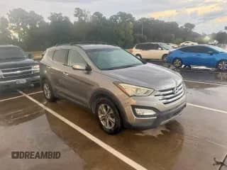 2015 Hyundai Santa Fe z VIN 5XYZU3LB2FG297317, wystawiony jako Copart lot #85947915 z przebiegiem 130 657 mil mil oraz Czysty tytuł • Clean title. Historia ofert i sprzedaży dostępna na DreamBid. Obrazek 1.