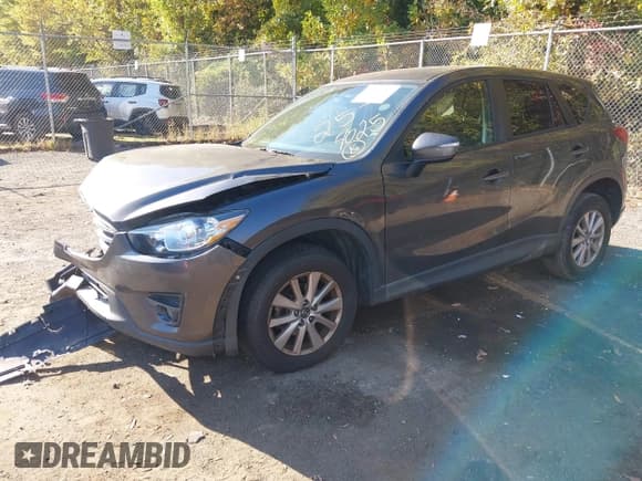 ✅ 2016 Mazda CX-5 Touring • VIN: JM3KE4CY5G0716056 • Lot: 43521281. Listed on IAAI with 107,968 mi. Free auction sales archive from the USA and detailed vehicle history report at DreamBid. Image 2.