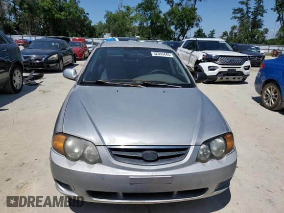 ✅ 2004 Kia Spectra GS • VIN: KNAFB161945141309 • Lot: 52395445. Listed on Copart with 99,100 mi. Free auction sales archive from the USA and detailed vehicle history report at DreamBid. Image 5.