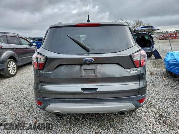 ✅ 2017 Ford Escape Titanium • VIN: 1FMCU0JDXHUD16122 • Lot: 95988025. Wystawiony na Copart z przebiegiem 63 513 mil. Bezpłatny archiwum sprzedaży aukcyjnych z USA i szczegółowy raport historii pojazdu na DreamBid. Zdjęcie 6.