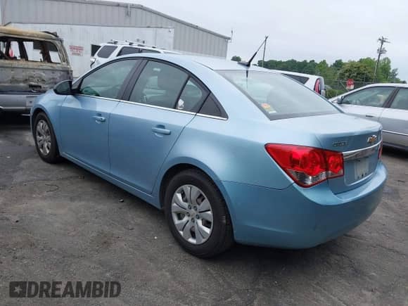 2012 Chevrolet Cruze LS z VIN 1G1PC5SHXC7312918, wystawiony jako IAAI lot #42380000 z przebiegiem 204 452 mil mil oraz . Historia ofert i sprzedaży dostępna na DreamBid. Obrazek 3.